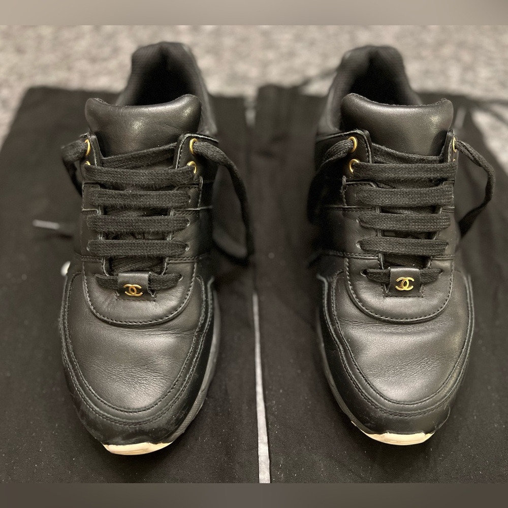 Sz 38 1/2 (8.5) previously loved CHANEL sneakers w/ gold hardware & 2 dust bags.
